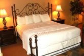 Photo of bed with white linen